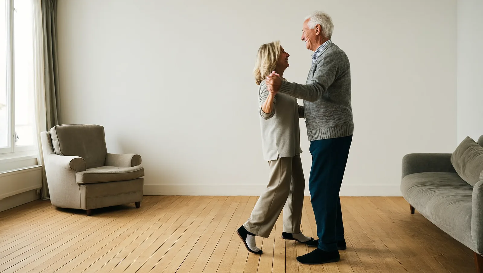 Older man and woman dancing in a living room